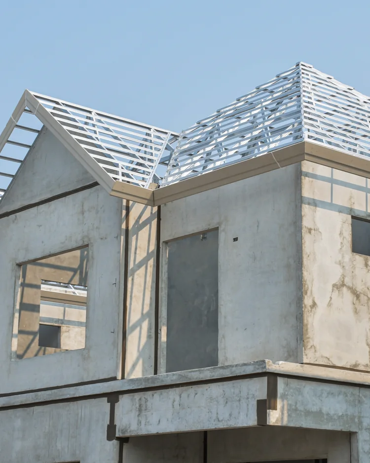 New home under construction with exposed roof framing