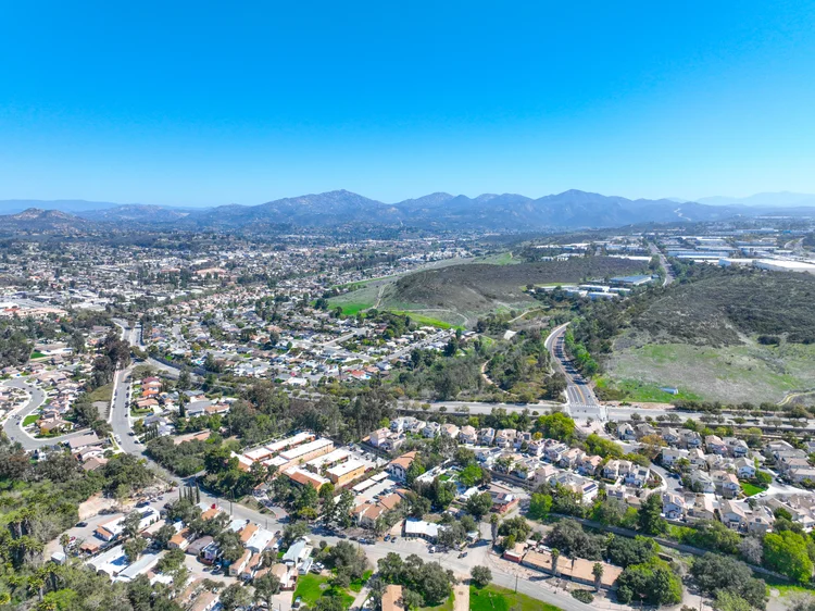 Aerial view of residential streets, homes, and yards in Poway, San Diego County.