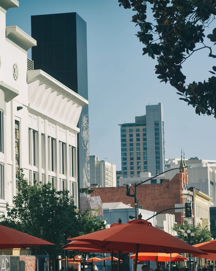 East Village street view with low-rise, mid-rise, and taller Downtown San Diego buildings