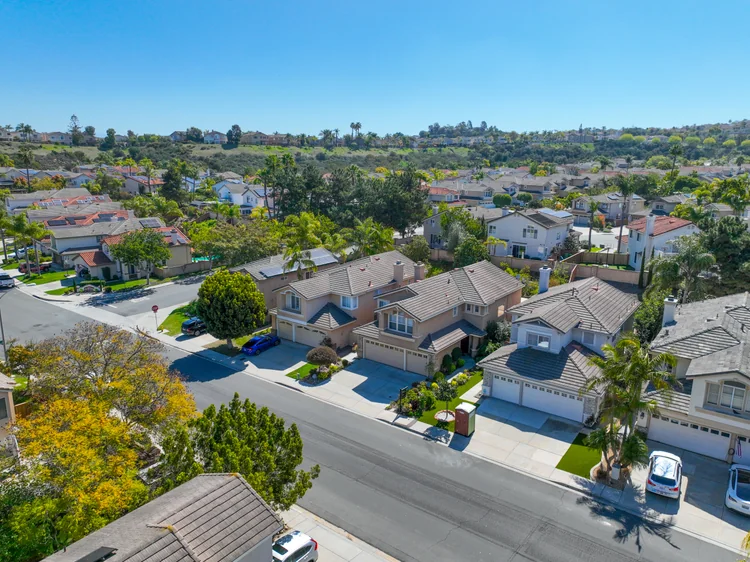 Detached homes along a residential street in San Diego County.