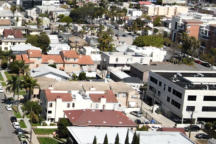 Aerial view of residential buildings and neighborhood streets.